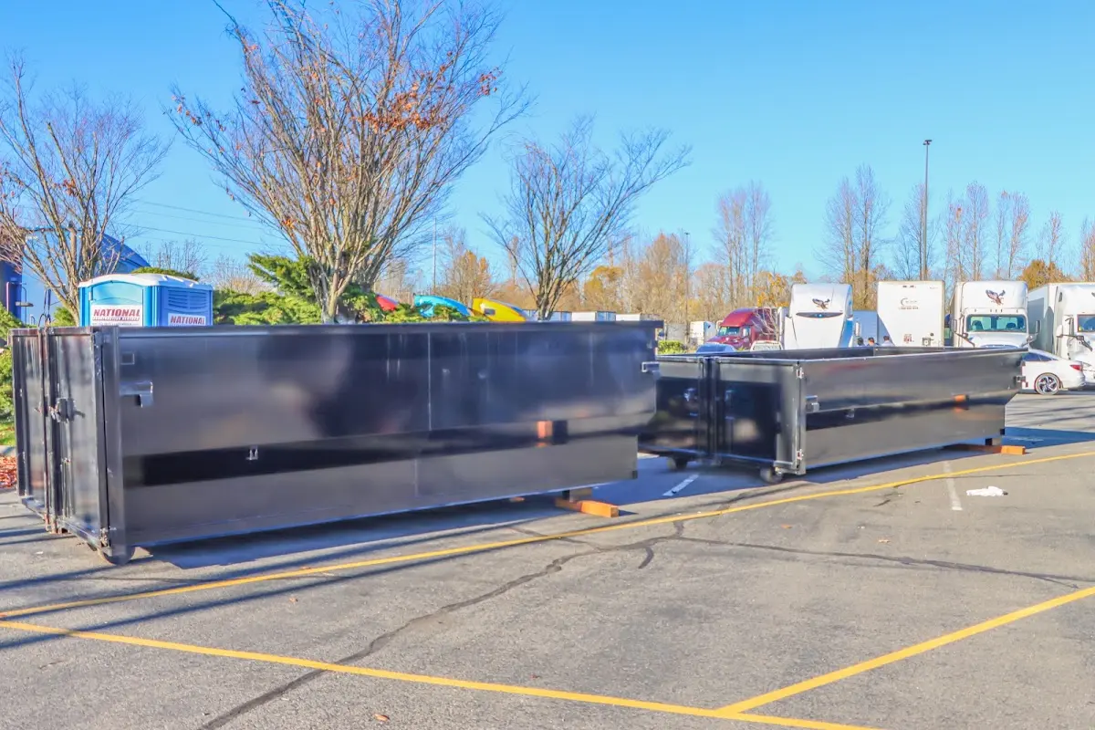 Professional dumpster rental service with roll-off container on residential driveway in South Lebanon
